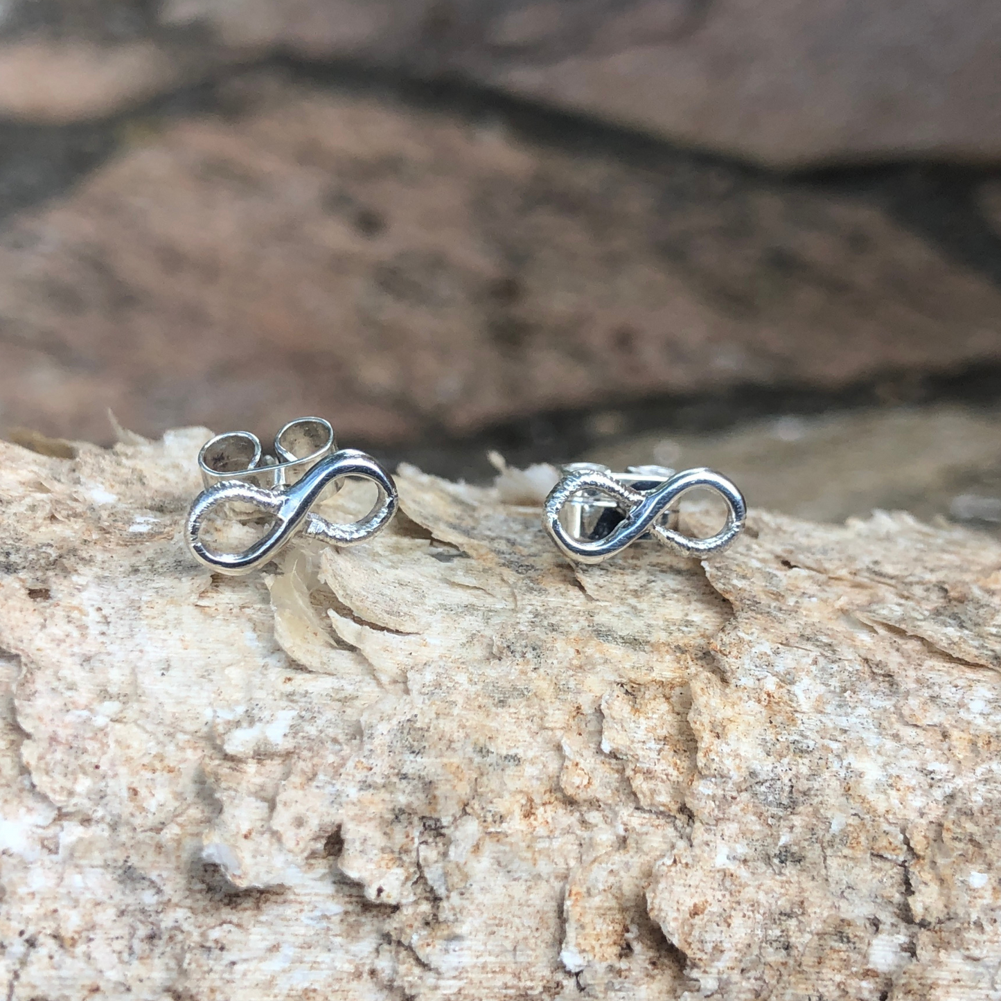infinity stud earrings