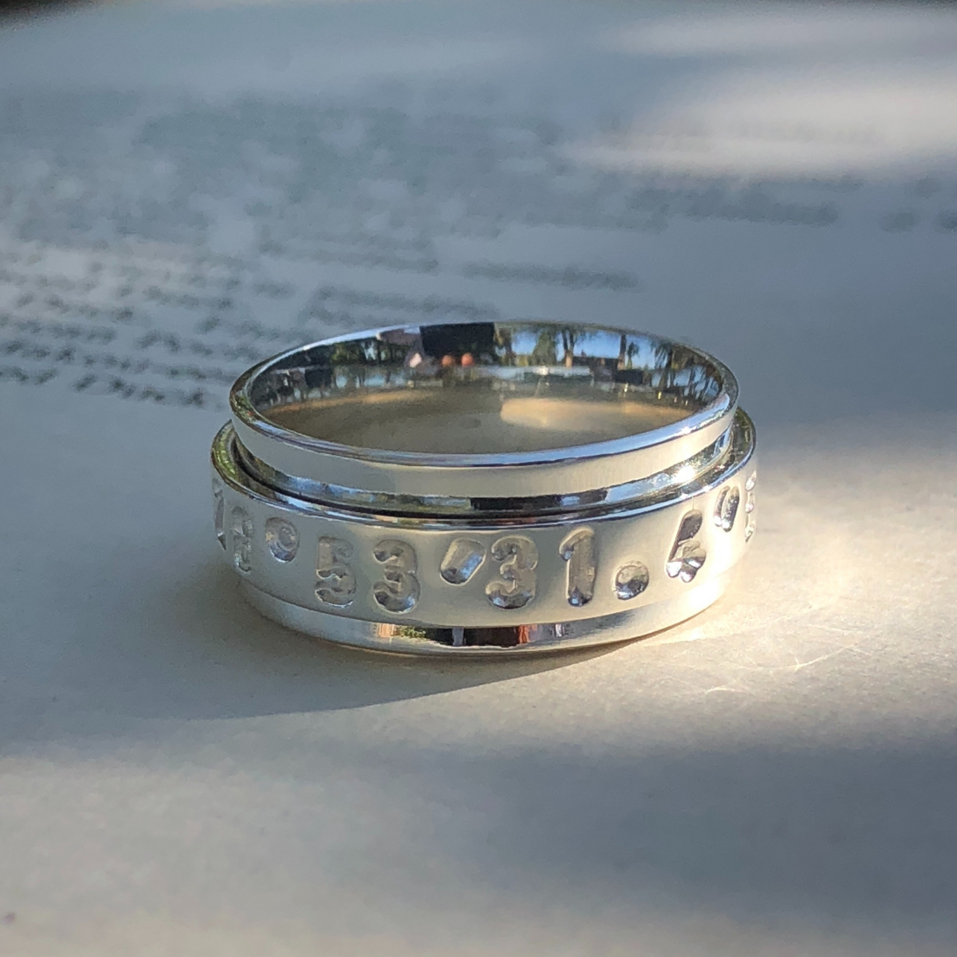 GPS swivel ring made in Zimbabwe, Africa by The Zuri Collection