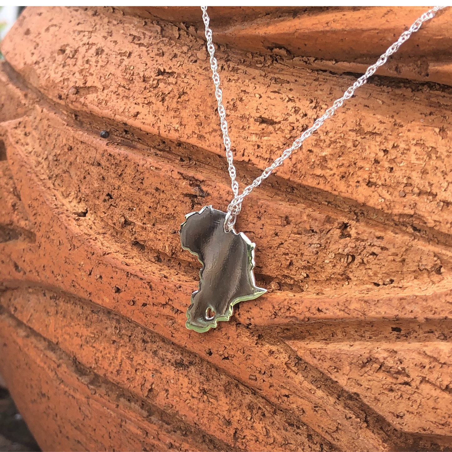 african necklace with a heart cut-out