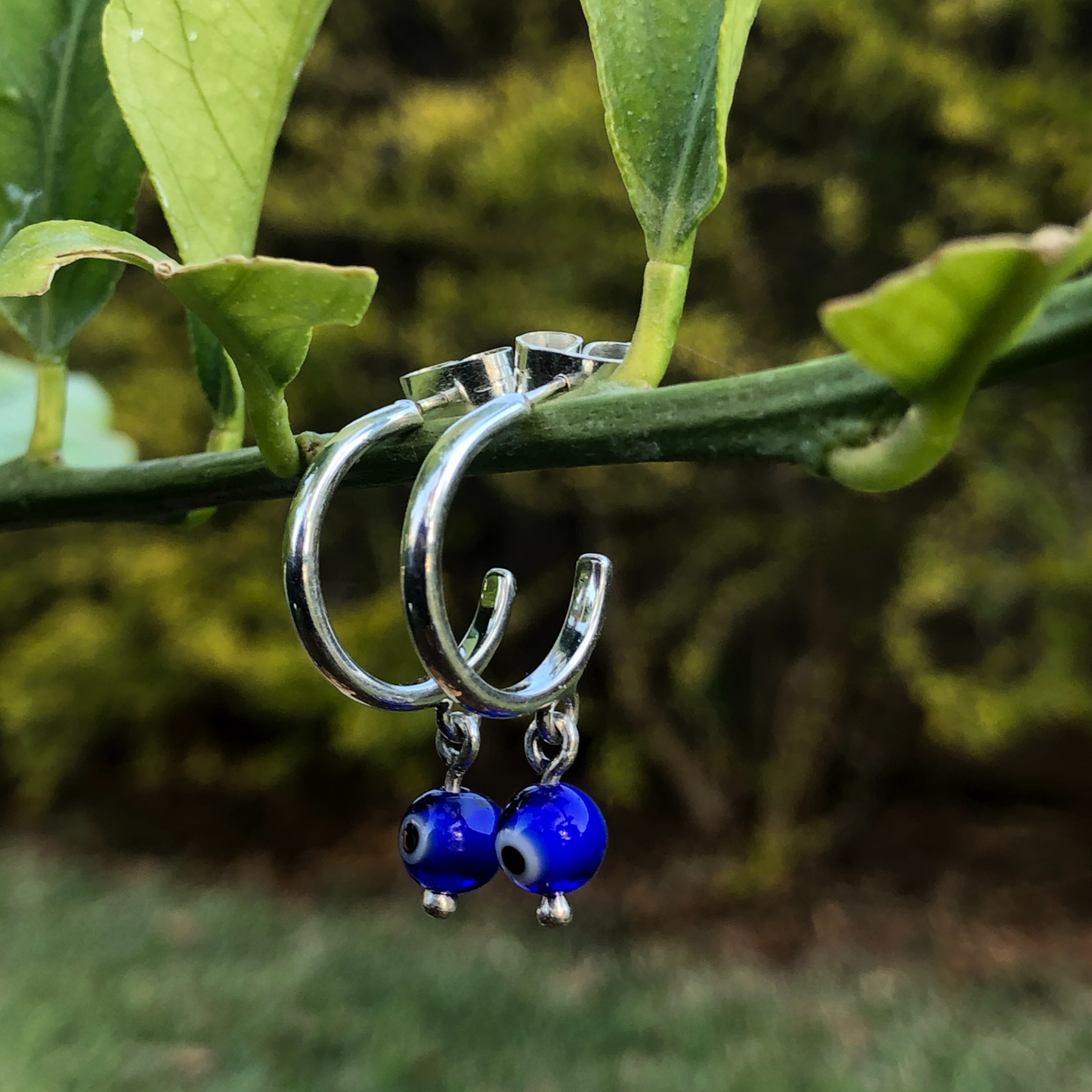 Silver evil eye earrings