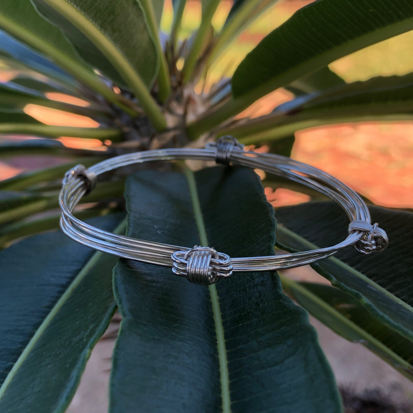 Simplistic and light weight four knot three elephant hair bangle