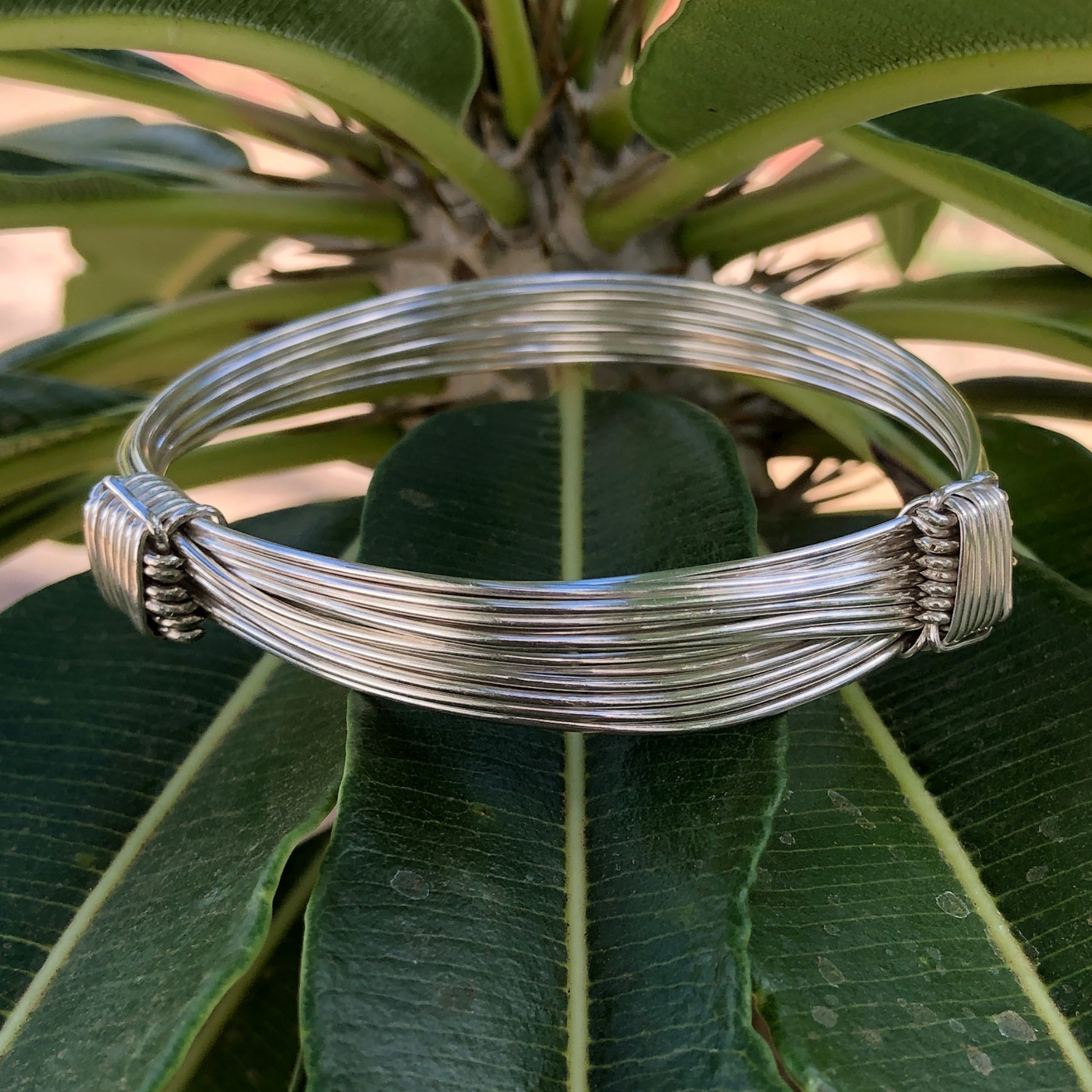 Shinny silver and adjustable two knot nine strand elephant inspired wire bracelets