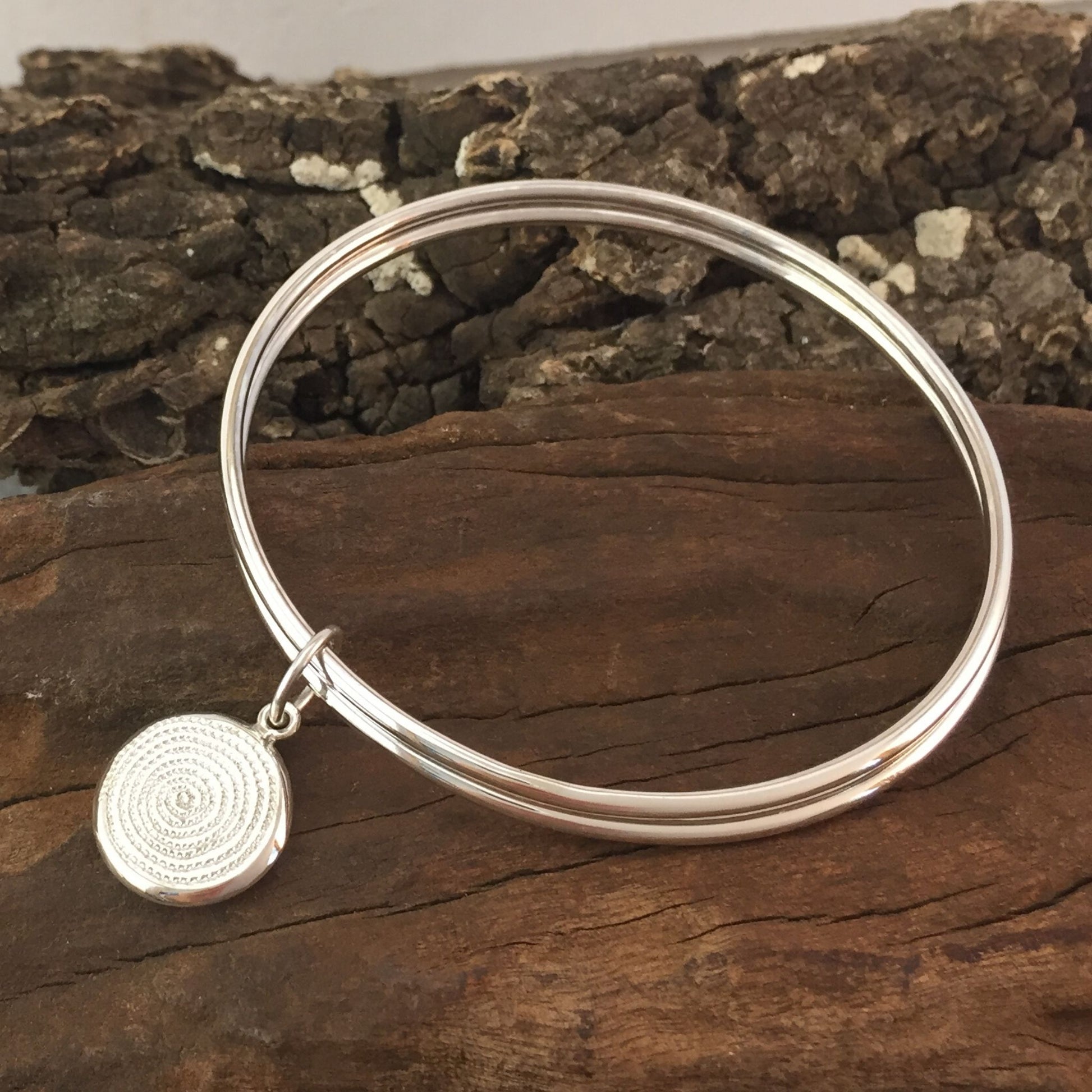 Double Plain Silver Bangles with Ndoro Pendant made by The Zuri Collection