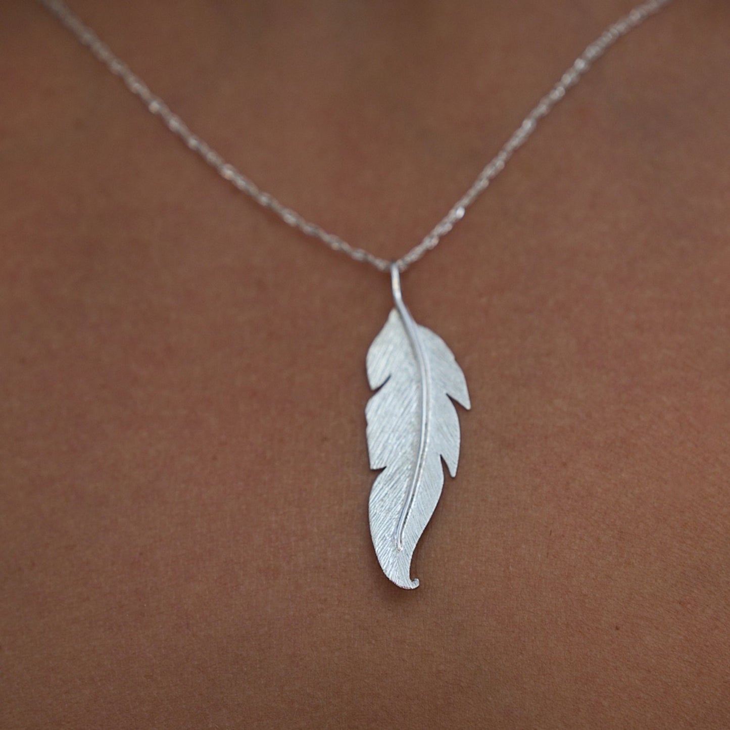 sterling silver feather necklace made in Africa by The Zuri Collection