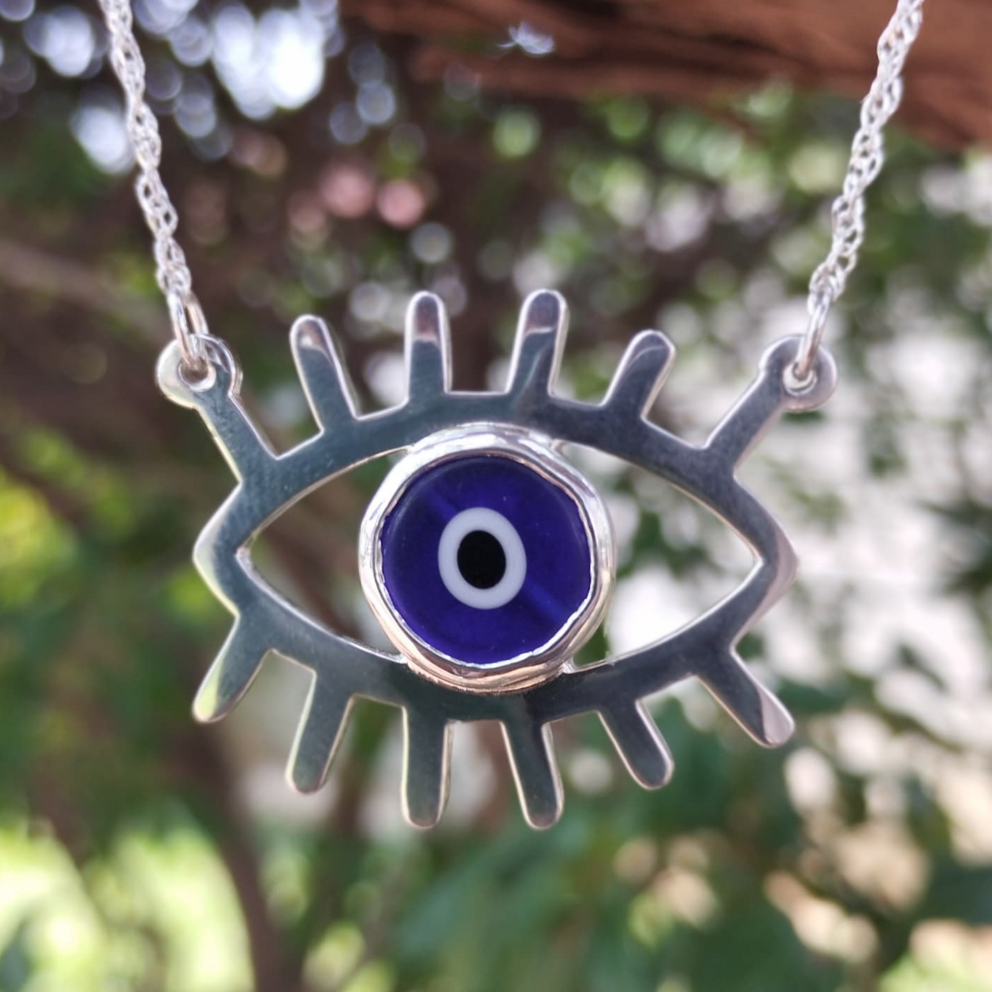 Blue evil eye necklace made in Zimbabwe