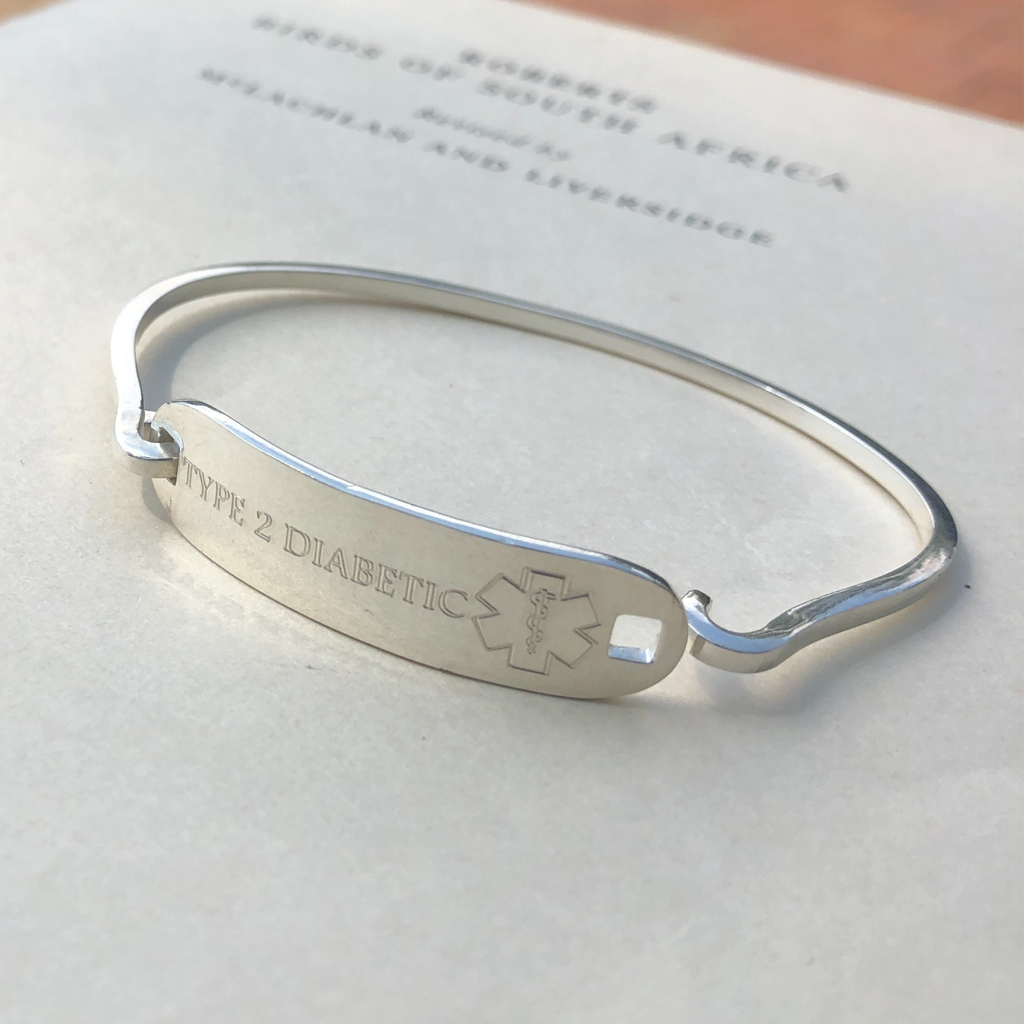Silver engraved medical alert bangle made in Africa by the Zuri Collection
