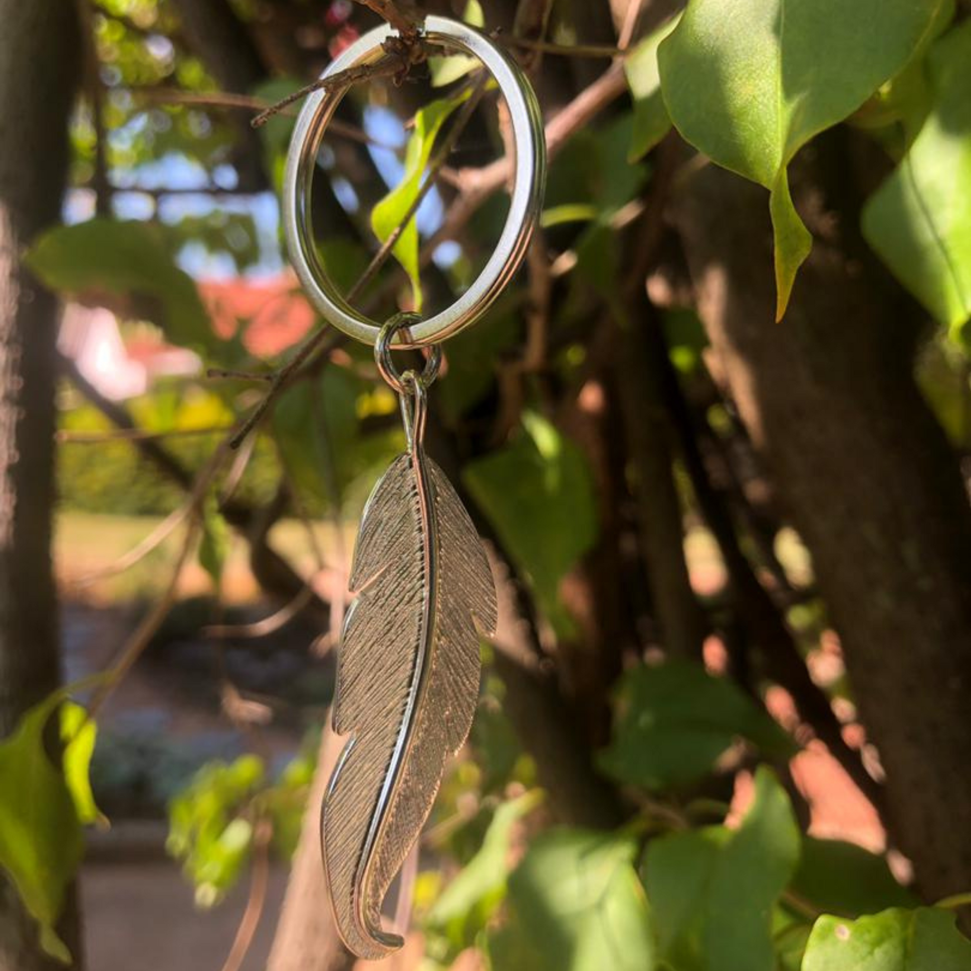 silver feather keychain made in Zimbabwe