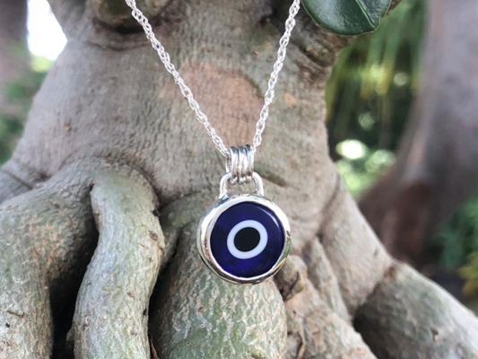 Sterling silver and blue evil eye necklace made in Zimbabwe by the Zuri collection